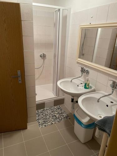 a bathroom with a sink and a shower and a toilet at Chata SOŠS Vrátna Dolina in Terchová