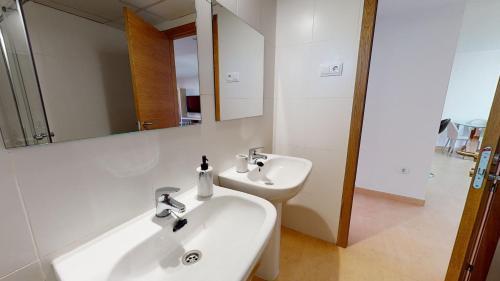 a white bathroom with a sink and a mirror at Casa PedroRoca-A Murcia Holiday Rentals Property in Torre-Pacheco