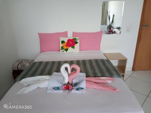 Ένα ή περισσότερα κρεβάτια σε δωμάτιο στο Minha casa pousada