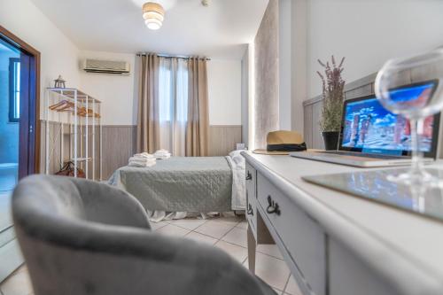 a living room with a bed and a tv in a room at Villa Rocla guest house Pompei in Pompei