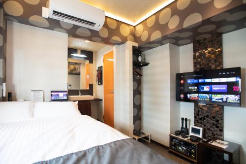 TV a/nebo společenská místnost v ubytování Hotel Xcell Hiroshima Nagarekawa