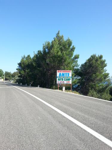 a sign on the side of a road at Rooms Ante in Tribanj-Krušćica