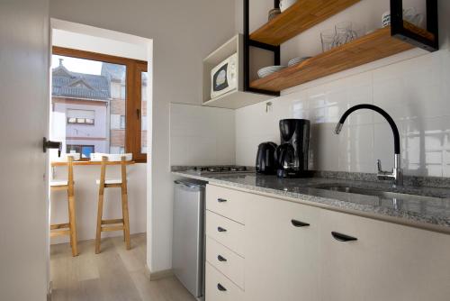 a kitchen with a sink and a counter top at Mitre Suite in San Carlos de Bariloche