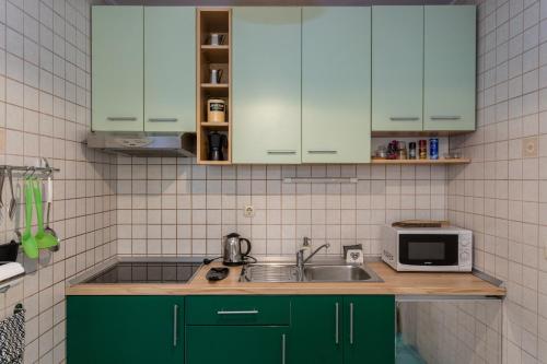 ครัวหรือมุมครัวของ Best Apartment Roxy