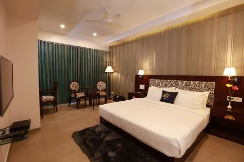 Een bed of bedden in een kamer bij The One Hotel