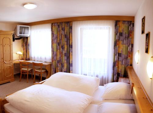 Posteľ alebo postele v izbe v ubytovaní Lärchenhof