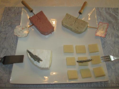 a white plate with different types of food on it at Gîte Les Acres Tranquilles B&B in Port-Daniel