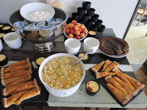 a table topped with lots of different types of food at L auberge du lion d or in Nanteuil-sur-Marne