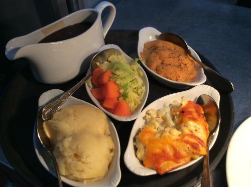 a tray with several dishes of food on a table at Arncliffe Arms in Glaisdale