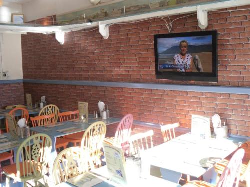 A restaurant or other place to eat at Watch House Barn 