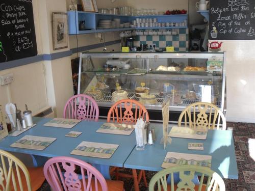 A restaurant or other place to eat at Watch House Barn 