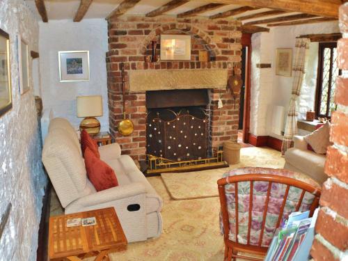 a living room with a couch and a fireplace at Church Villa B & B in Chesterfield