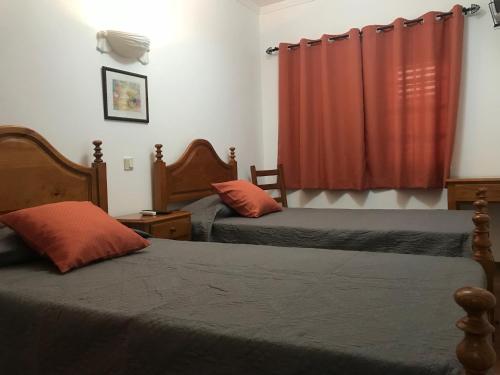 Ένα ή περισσότερα κρεβάτια σε δωμάτιο στο Quartos de Vidigueira