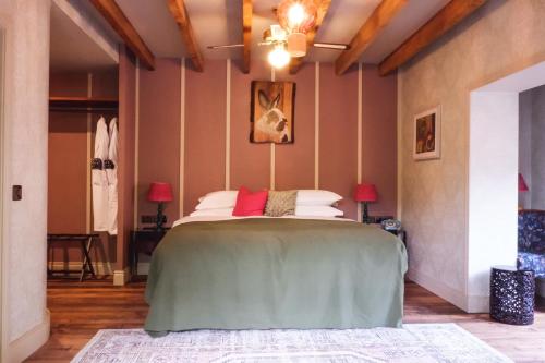 a bedroom with a large bed in a room at The Rabbit Hotel & Retreat in Templepatrick