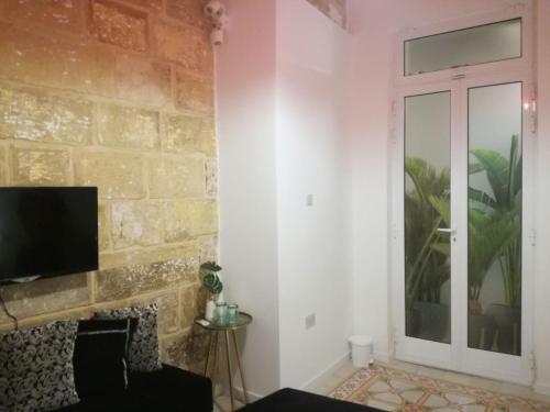 A television and/or entertainment center at 19, Luqa Townhouse