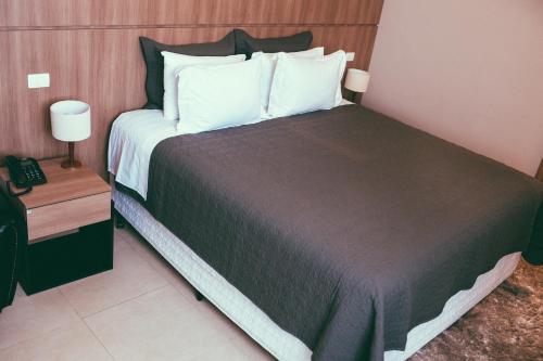 Postel nebo postele na pokoji v ubytování Occitano Apart Hotel