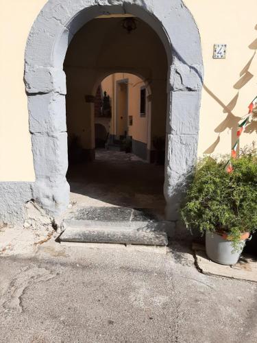 an archway in a building with two potted plants at casa anna in Vico Equense