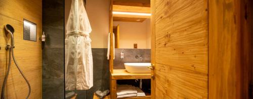 a bathroom with a sink and a shower at Gran Baita Hotel & Wellness in Courmayeur