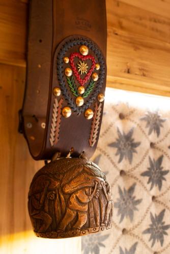 a purse is hanging on a wall with a box at Gran Baita Hotel & Wellness in Courmayeur