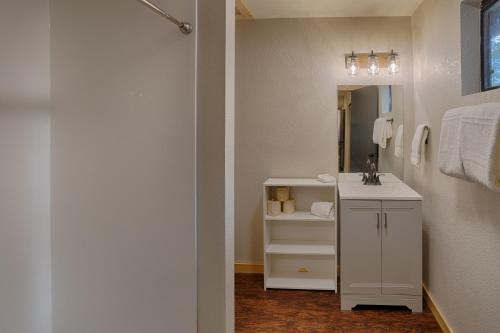 a bathroom with a sink and a mirror at Buck Springs Resort in Pinetop-Lakeside