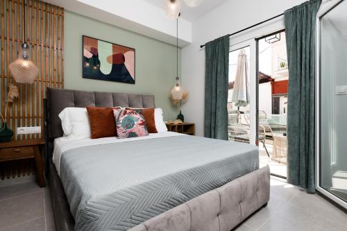 En eller flere senge i et værelse på Iliana & Sarra Apartment 2