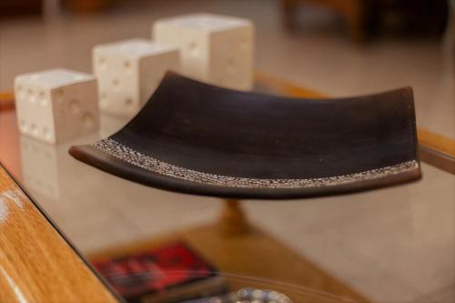 a black hat sitting on top of a table at Don Pepe Hotel y Cabañas in El Calafate