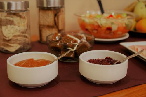 two bowls of food sitting on top of a table at Don Pepe Hotel y Cabañas in El Calafate