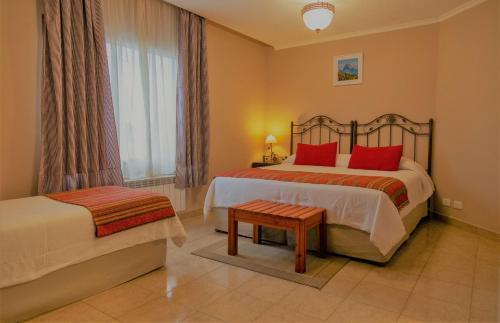 Cama ou camas em um quarto em Don Pepe Hotel y Cabañas