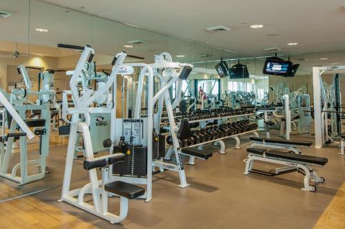 a gym with a bunch of treadmills and machines at Portofino Tower 3 Unit 1609 in Pensacola Beach