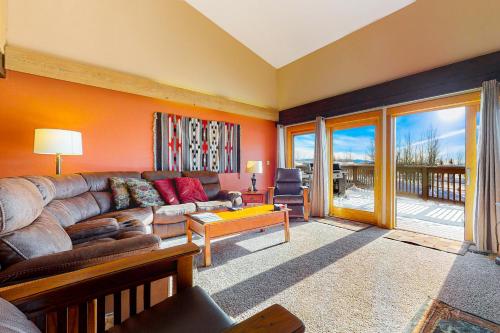 a living room with a couch and a table at Timber Ridge 4 in Teton Village