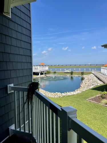 a view from the balcony of a house with a pond at Comfort Suites Chincoteague Island Bayfront Resort in Chincoteague