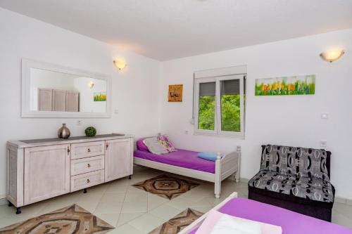 Ένα ή περισσότερα κρεβάτια σε δωμάτιο στο Apartmani LIRA