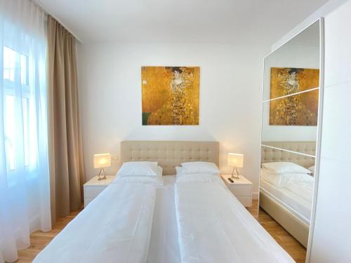 Posteľ alebo postele v izbe v ubytovaní Steiner Residences Vienna Nestroyplatz