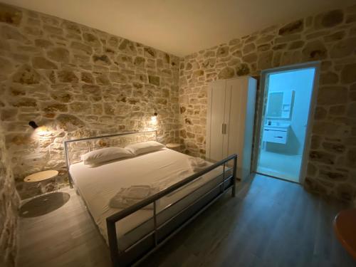 Postel nebo postele na pokoji v ubytování Lemons&Olives Rooms