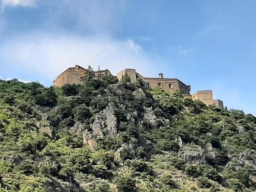 a castle on the top of a mountain at Les Chambres Chouettes in Villefranche-de-Conflent
