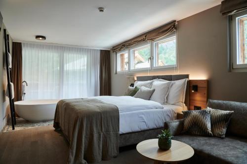 Postel nebo postele na pokoji v ubytování Matthiol Boutique Hotel