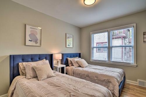 A bed or beds in a room at Cozy Home WiFi, Parking, 5 Mi to Dtwn Mpls!