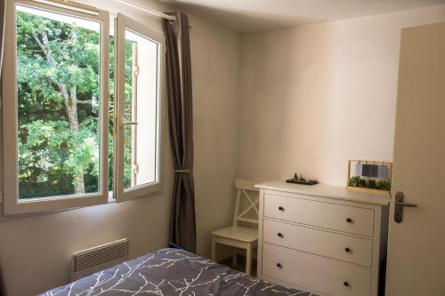 Katil atau katil-katil dalam bilik di Golf Domaine Albret - Charmant duplex T3 ré-équipé avec piscine et terrasse aménagée