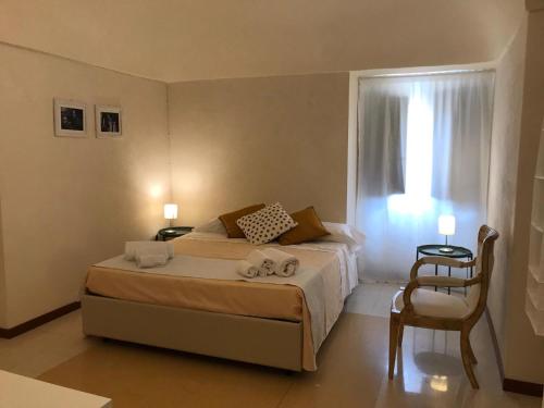 Postel nebo postele na pokoji v ubytování Landolina Palace Hotel
