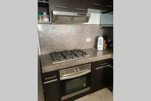 Nhà bếp/bếp nhỏ tại Hermoso Departamento Amueblado frente al mar