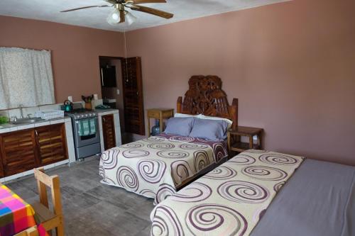 Кровать или кровати в номере Bungalows Casa Blanca