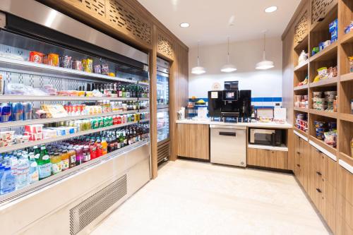 a grocery store aisle with shelves of food at Holiday Inn San Jose-Silicon Valley by IHG in San Jose
