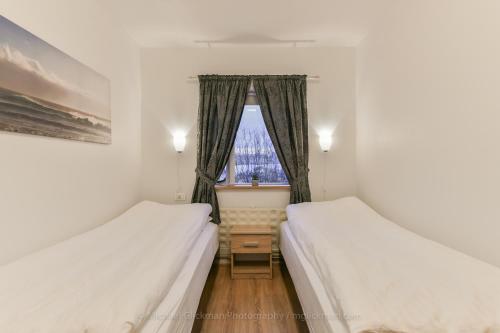 Garður guesthouseにあるベッド