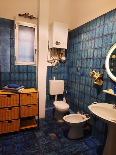Een badkamer bij Suite Tolemaide