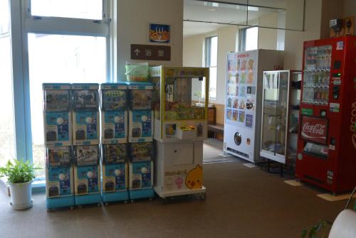 a store with a bunch of vending machines in a room at Highland Furano in Furano