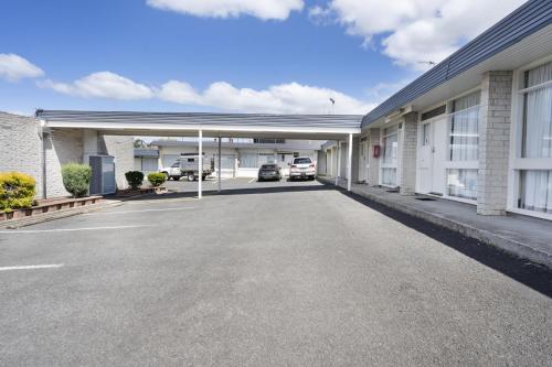 an empty parking lot in front of a building at Top of the Town Hotel Motel in Burnie