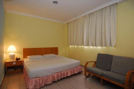 Cama ou camas em um quarto em Hotel City View