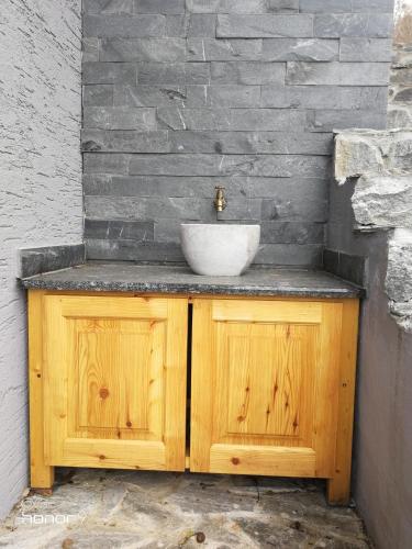 a bathroom sink with a bowl on top of it at Holiday Home Wanderlust Lendava in Lendava