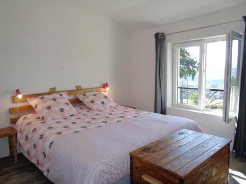 a bedroom with a large bed and a window at Gîte Régny, 4 pièces, 6 personnes - FR-1-496-221 in Regny