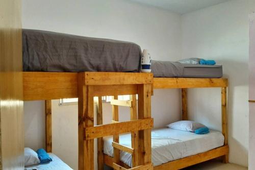 a couple of bunk beds in a room at El Costeñito Hostal in Veracruz